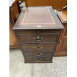 A MODERN MAHOGANY TWO DRAWER FILING CABINET WITH INSET LEATHER TOP AND PULL-OUT SLIDE, ALSO WITH