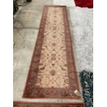 A SMALL ORANGE PATTERNED HARTH RUG