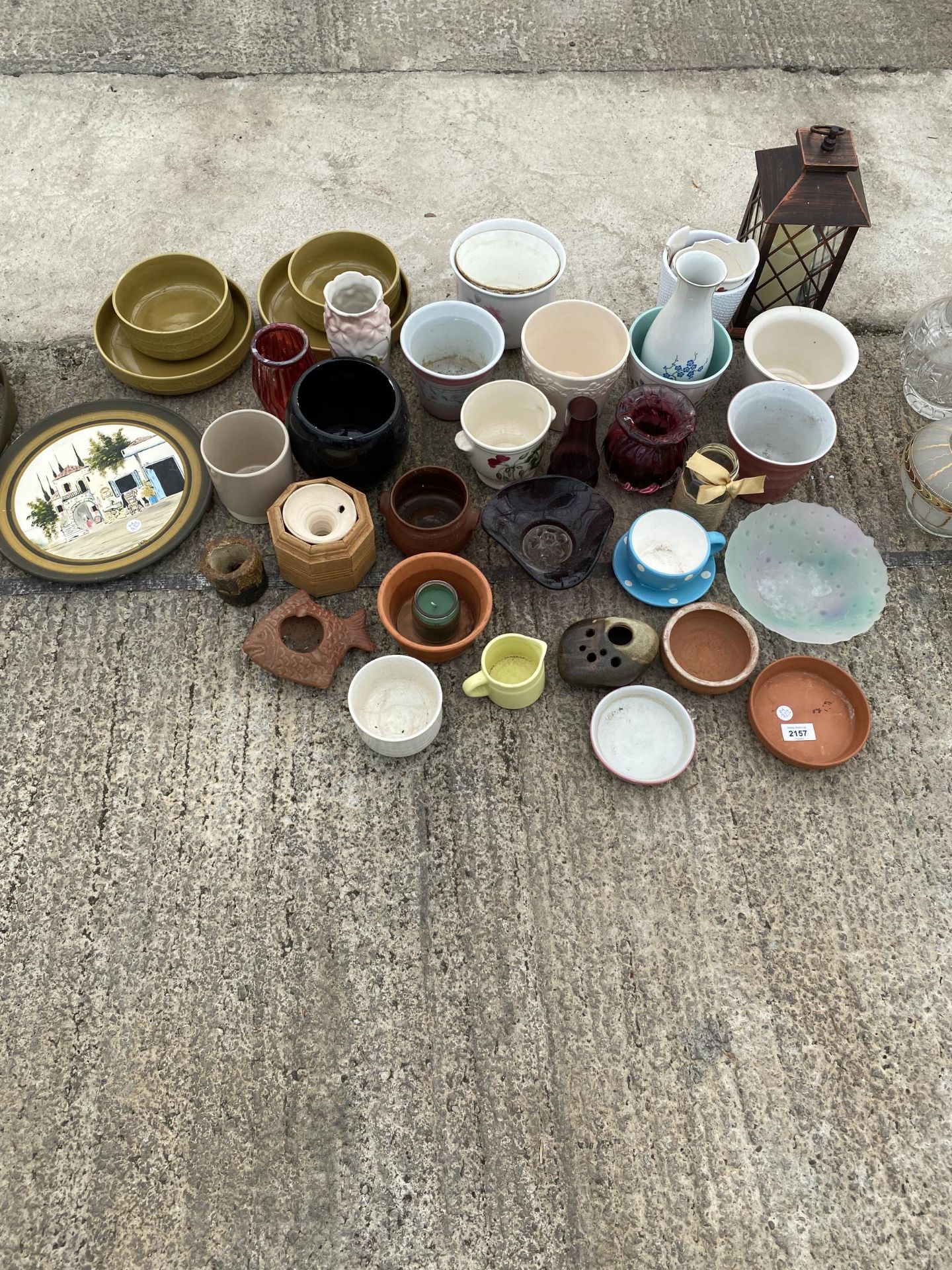AN ASSORTMENT OF CERAMIC PLANT POTS AND CANDLE HOLDERS ETC