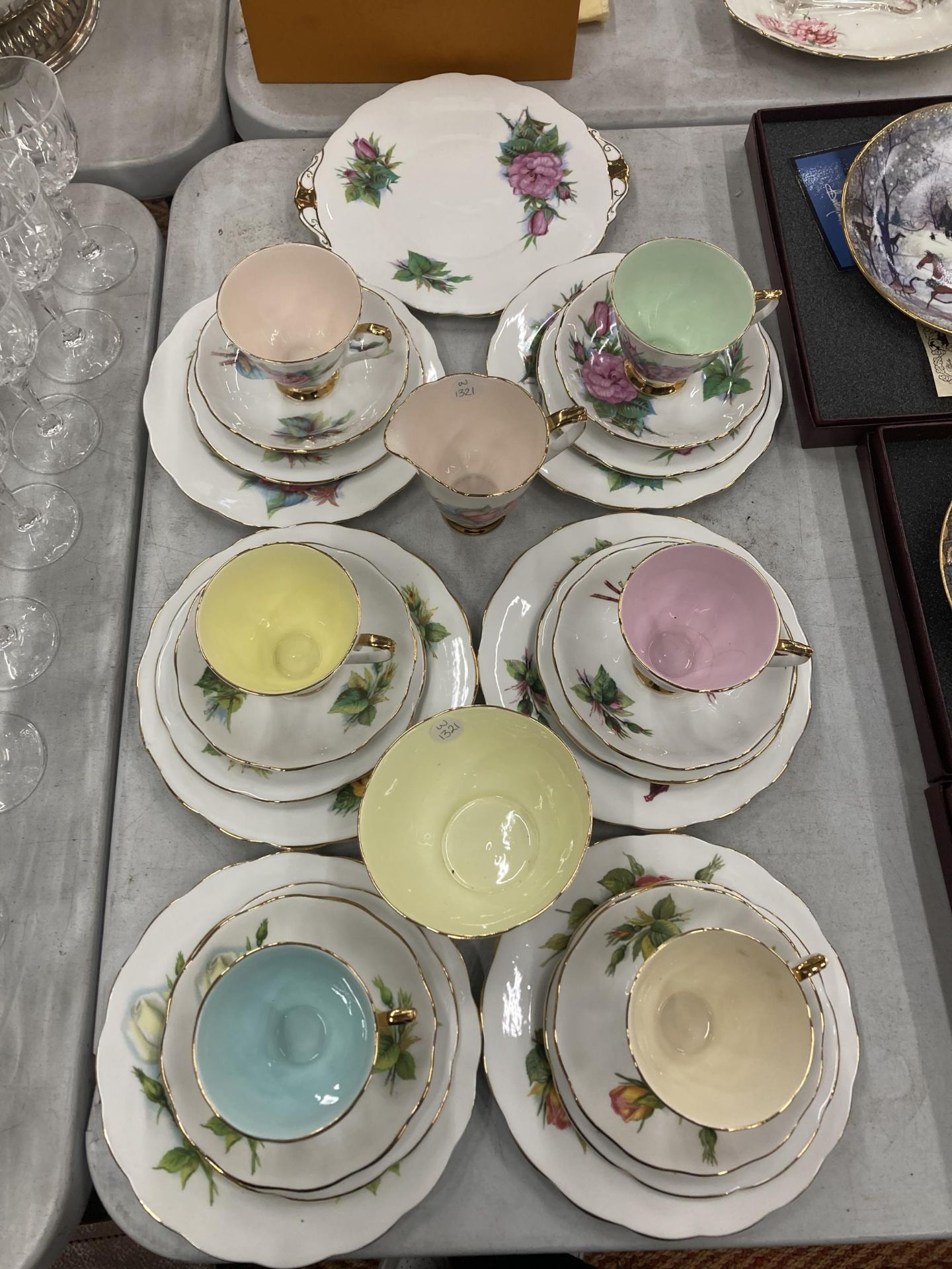 A COLLECTION OF FLORAL DESIGN BONE CHINA TRIOS