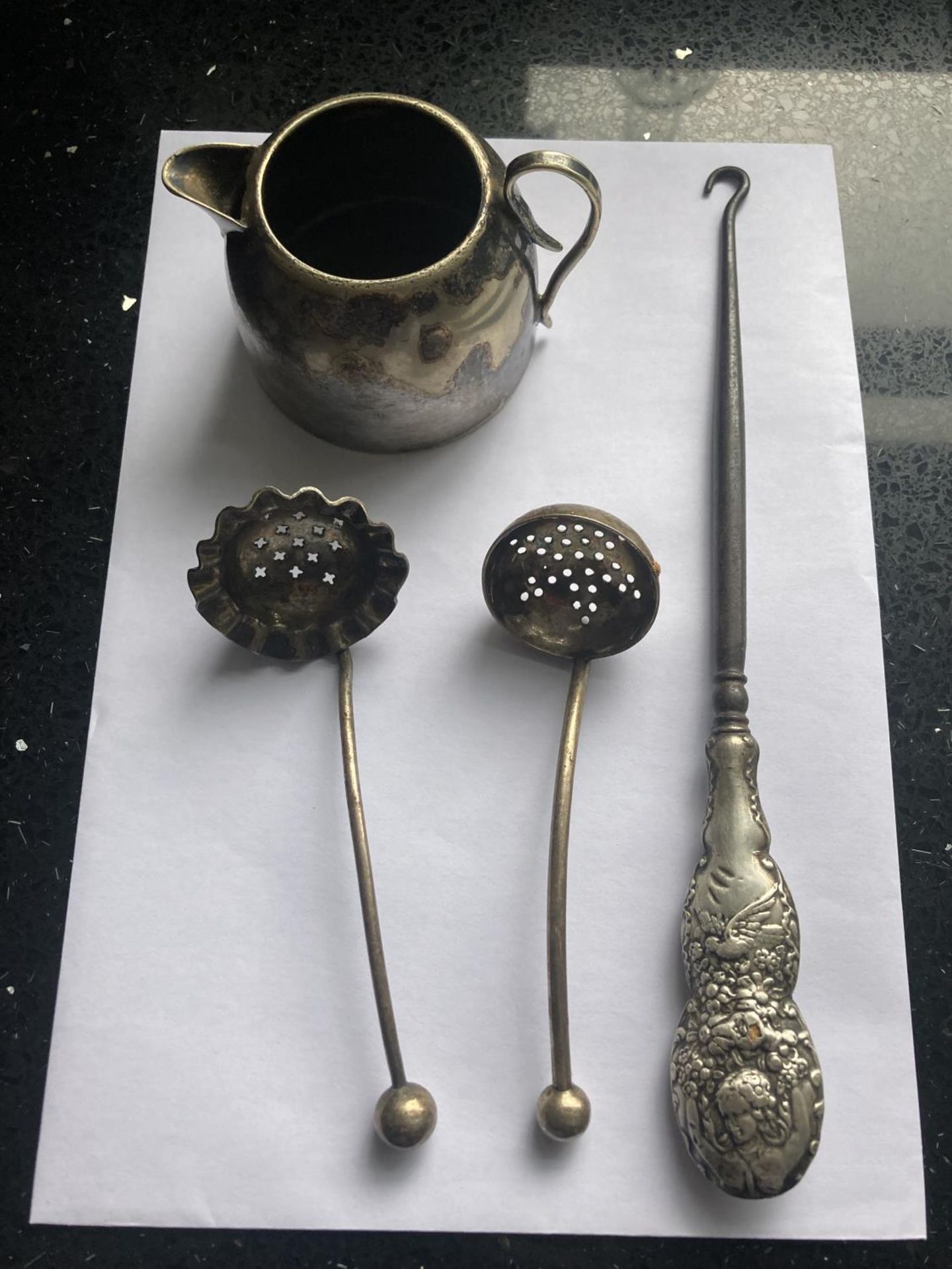 FOUR ITEMS TO INCLUDE AN INDISTINCT HALLMARKED SILVER HANDLED BUTTON HOOK, A MAPPIN AND WEBB PRINCES