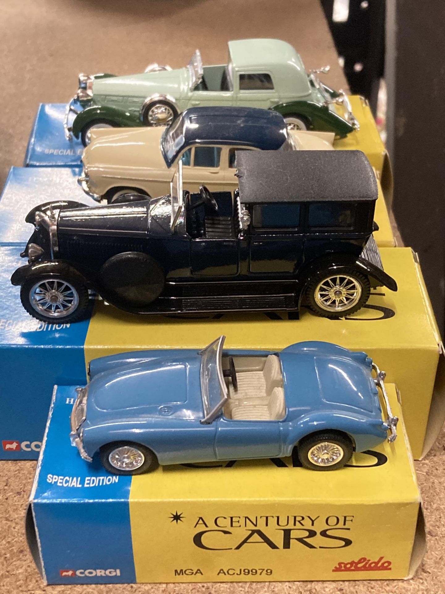 FOUR BOXED CORGI 'A CENTURY OF CARS' TO INCLUDE AN MGA, SIMBA, DELOGE COUP DE VILLE AND A PANHARD ET