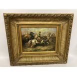 A DECORATIVE GILT FRAMED OIL ON BOARD OF AN ARABIAN HORSEBACK BATTLE SCENE