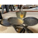 A SMALL BRASS JAM PAN PLUS THREE BRASS SKILLETS