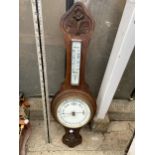 AN OAK CASED BAROMETER