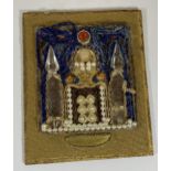 AN UNSUSUAL SMALL PICTURE BEAD MONTAGE OF A RELIGIOUS BUILDING, SIGNED AND DATED 1916, PAPER LABEL