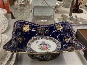 A COBALT BLUE AND GILT TWIN HANDLED BOWL WITH HAND PAINTED DESIGN, SIGNED L.MONET