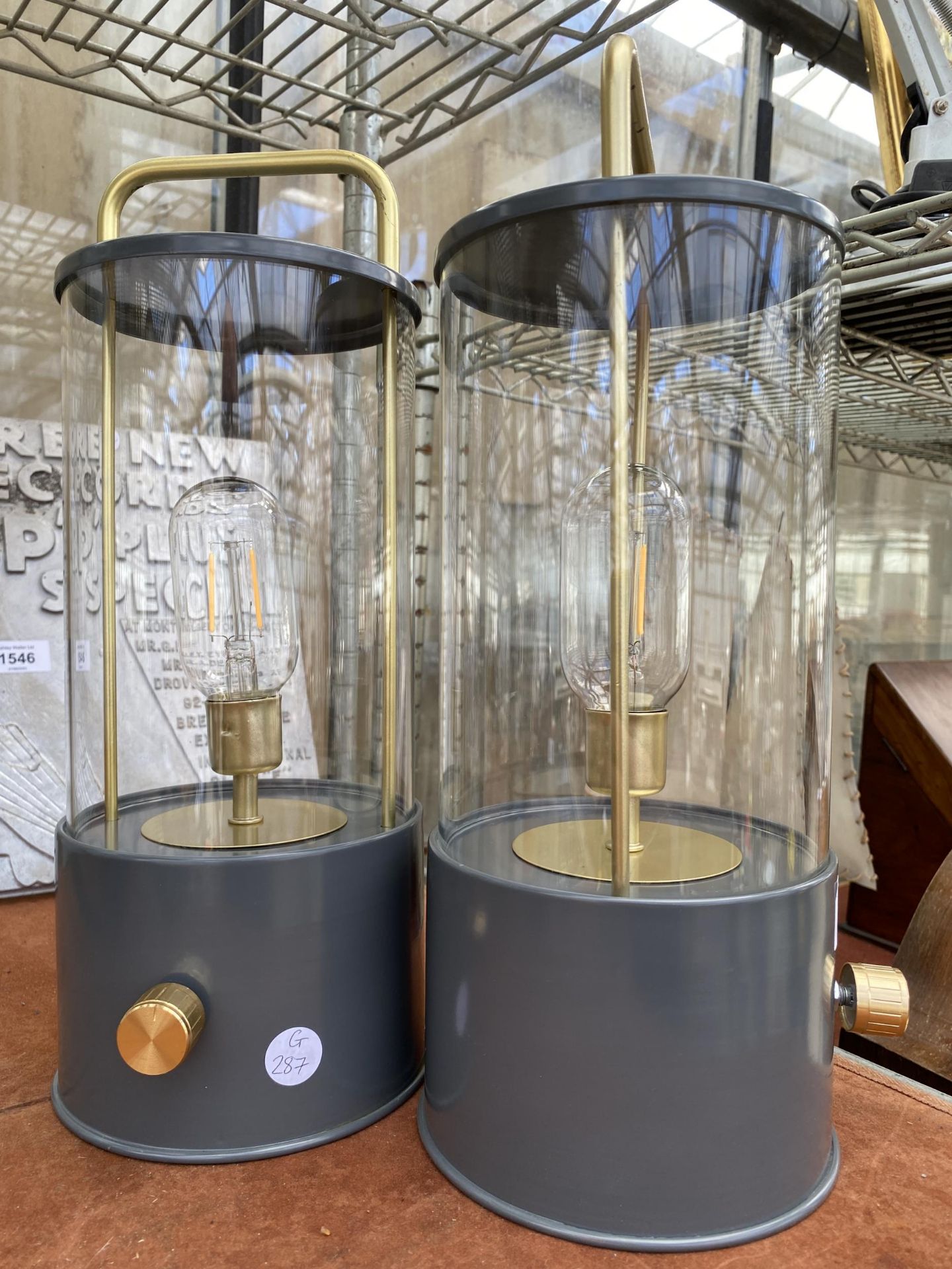 A PAIR OF BATTERY OPERATED LANTERNS