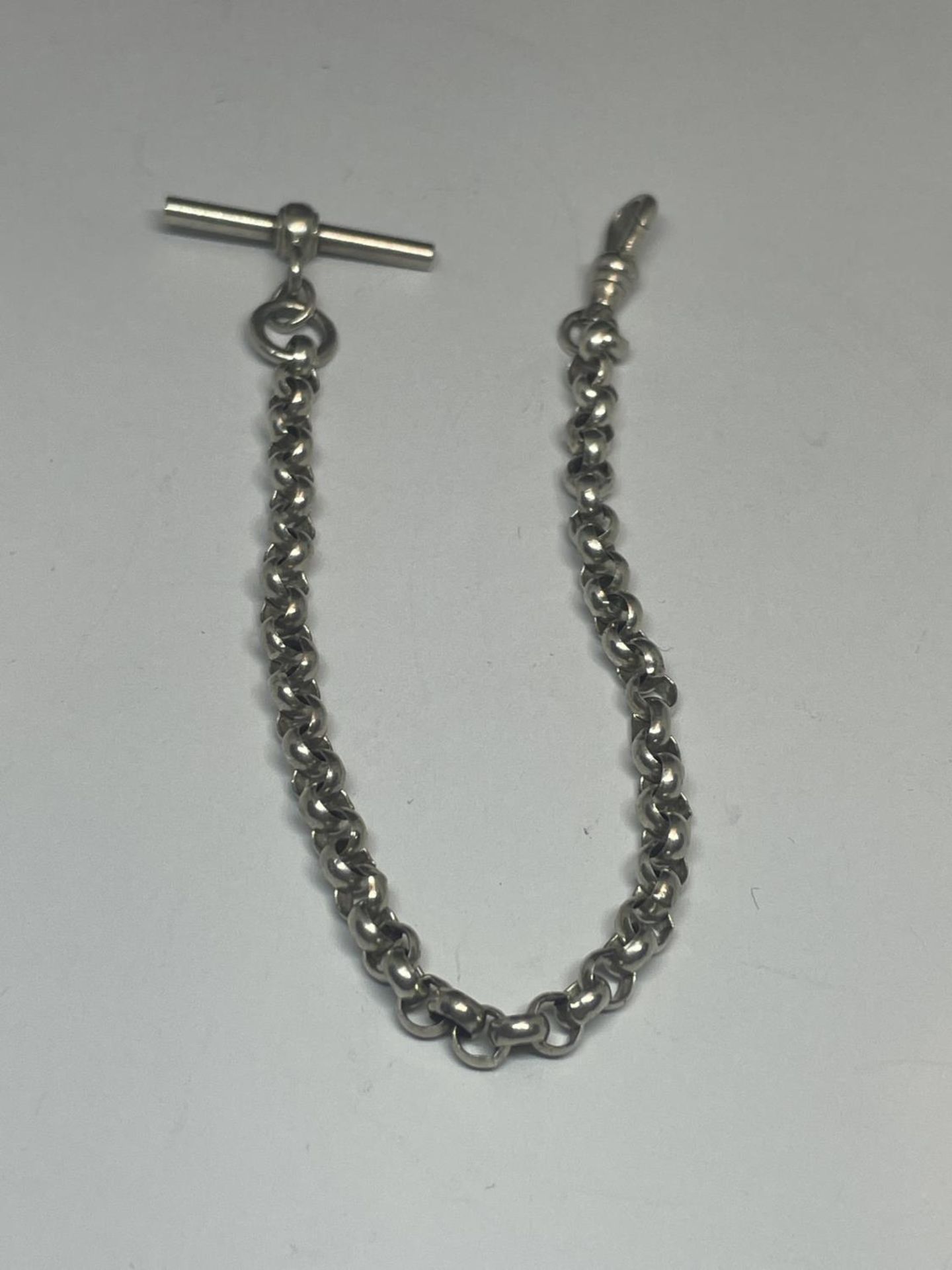 A SILVER HALF ALBERT WATCH CHAIN