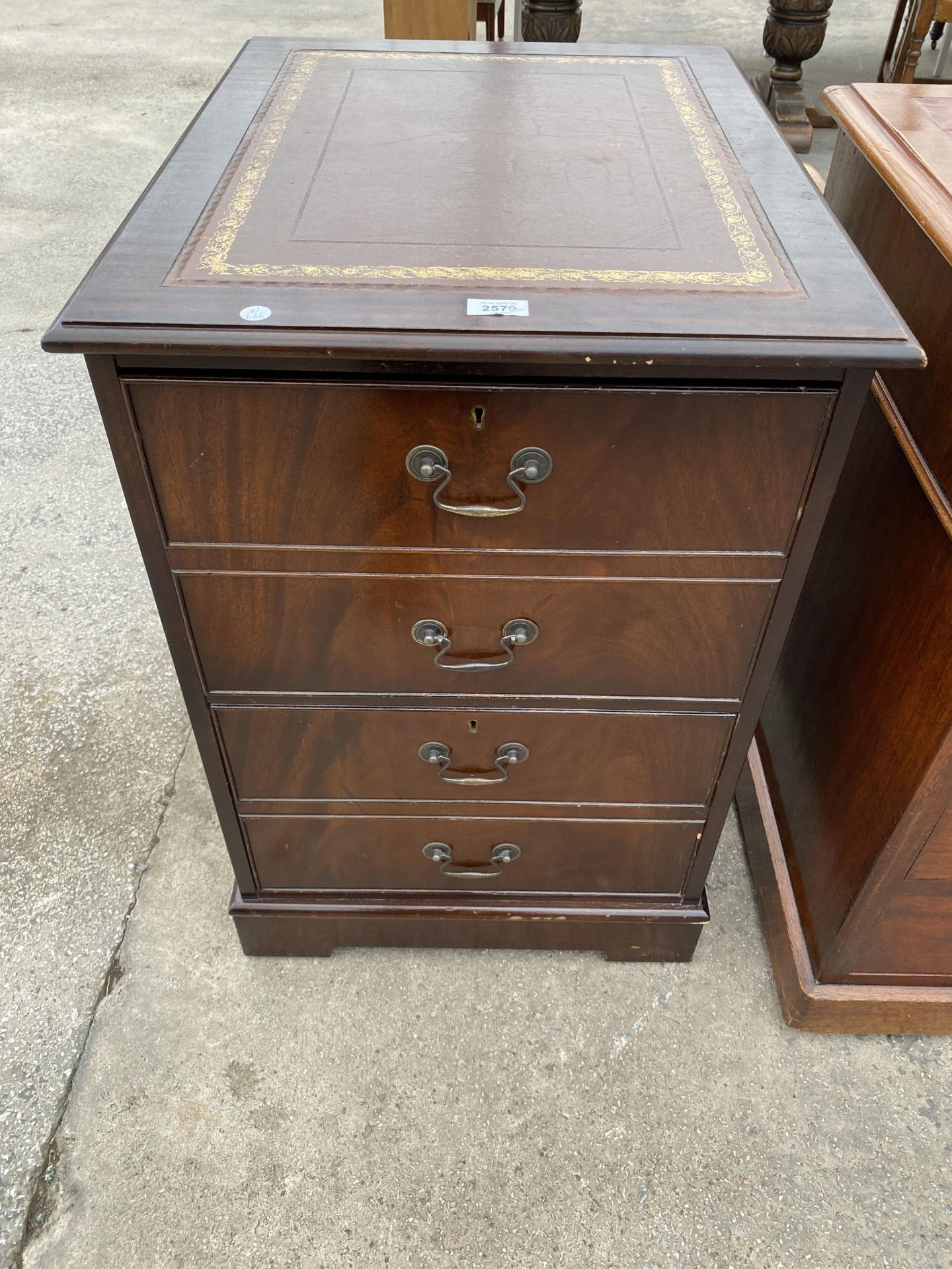 A MODERN MAHOGANY TWO DRAWER FILING CABINET WITH INSET LEATHER TOP