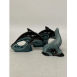 TWO POOLE POTTERY DOLPHIN FIGURES TOGETHER WITH A SEAL