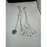 FOUR SILVER NECKLACES WITH PENDANTS