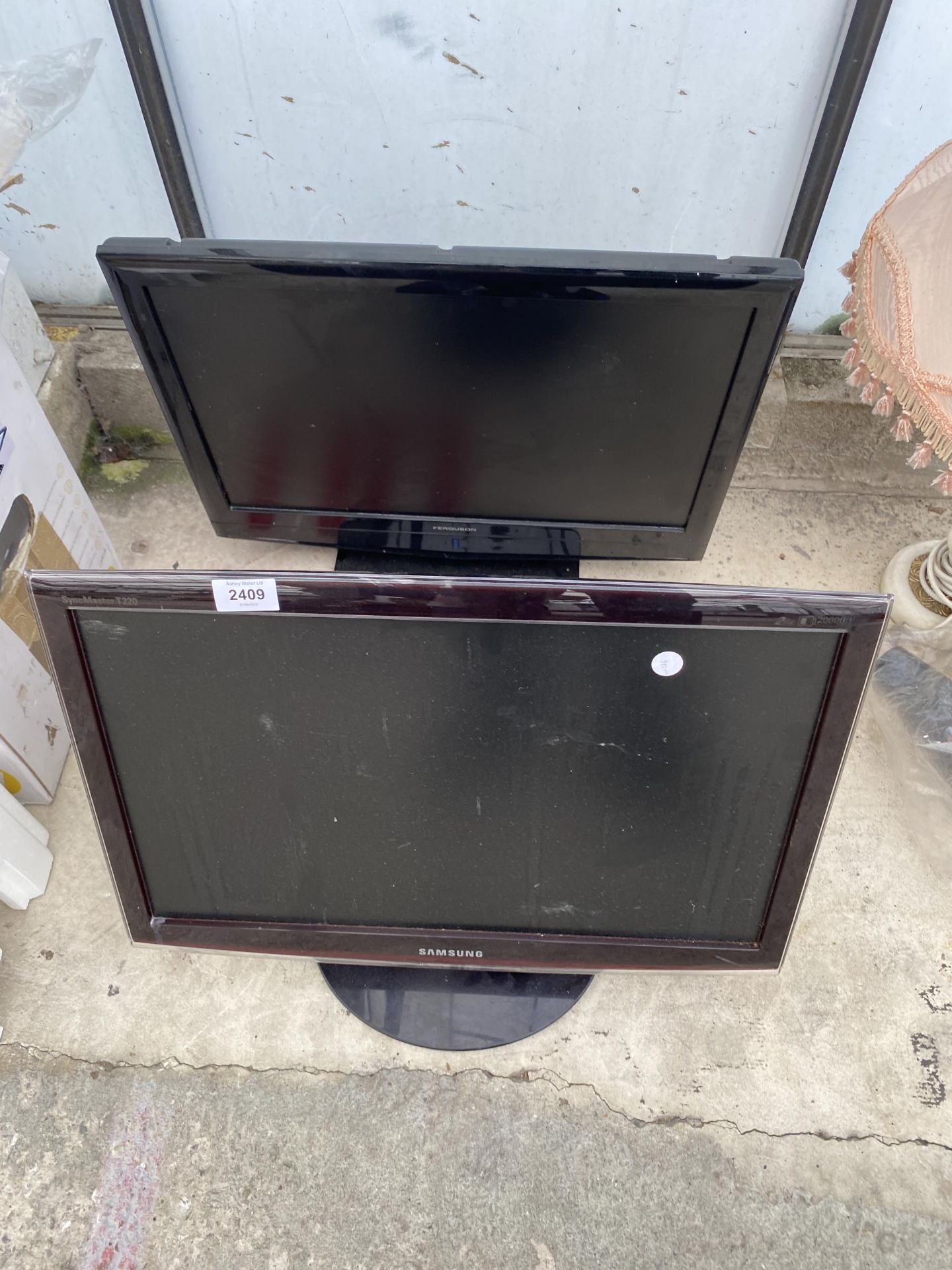 A SAMSUNG MONITOR AND A FERGUSON TELEVISION