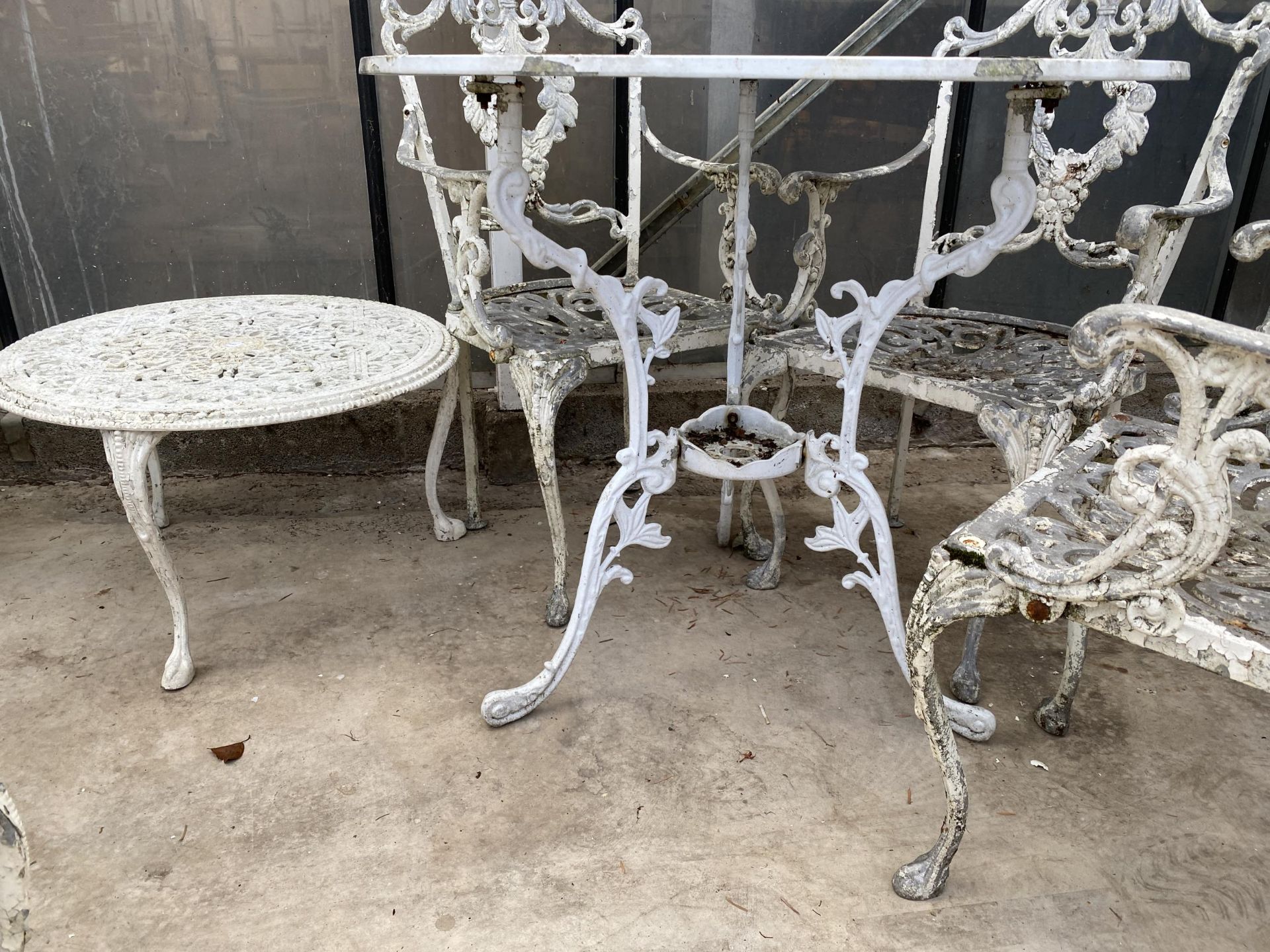 A VINTAGE CAST ALLOY BISTRO SET COMPRISING OF A ROUND TABLE, FOUR CARVER CHAIRS AND A COFFEE TABLE - Image 3 of 5