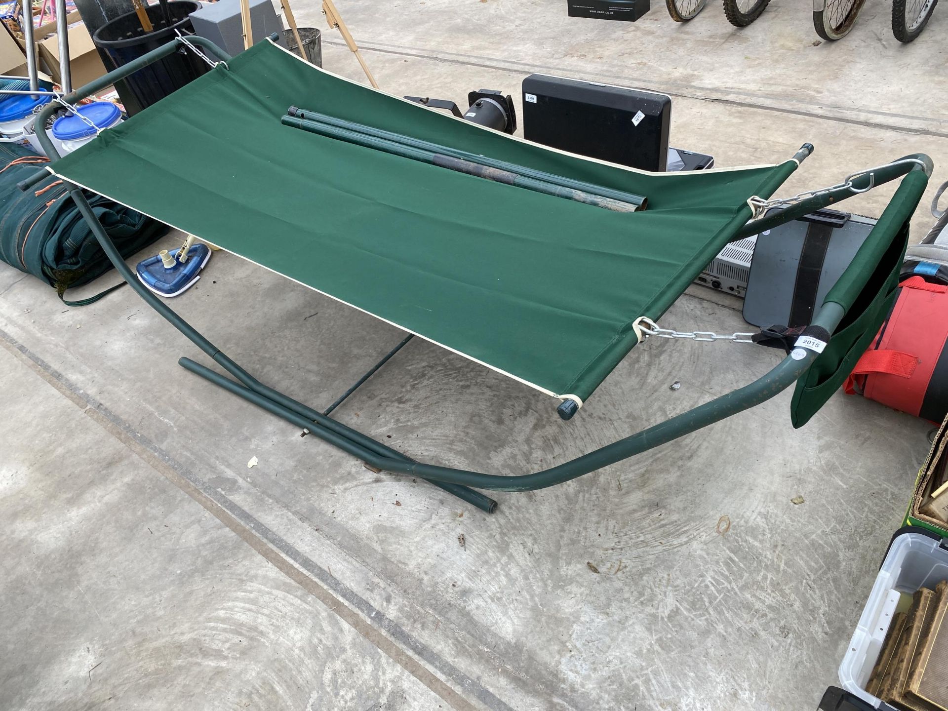 A METAL FRAMED SWINGING HAMMOCK