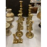 A COLLECTION OF TEN ASSORTED VINTAGE BRASS CANDLESTICKS