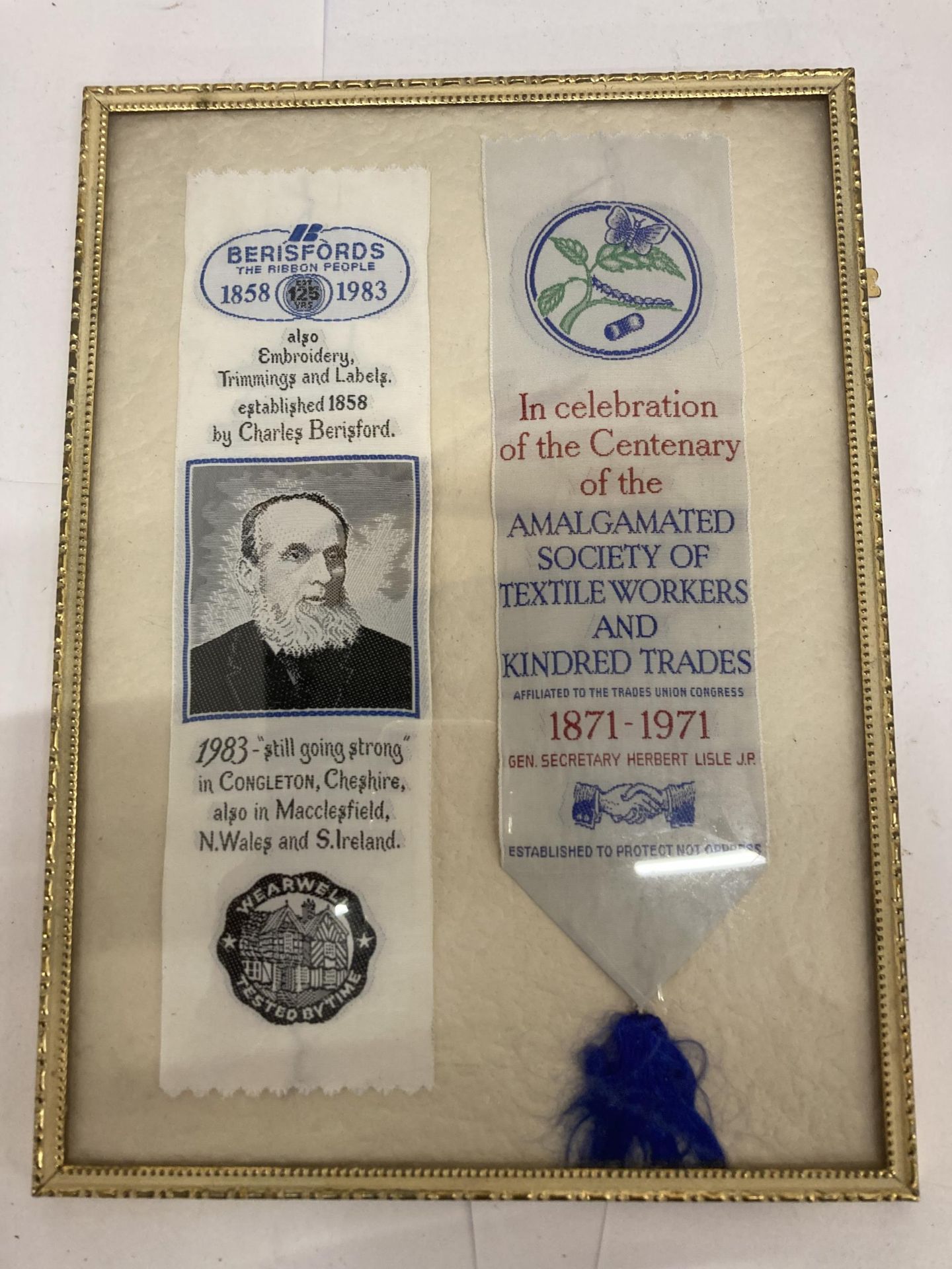 A FRAMED SILK RIBBONS AMALGAMATED SOCIETY OF TEXTILE WORKERS AND BERISFORDS EMBROIDERY RIBBON AWARD