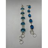 TWO BRACELETS WITH BLUE STONES