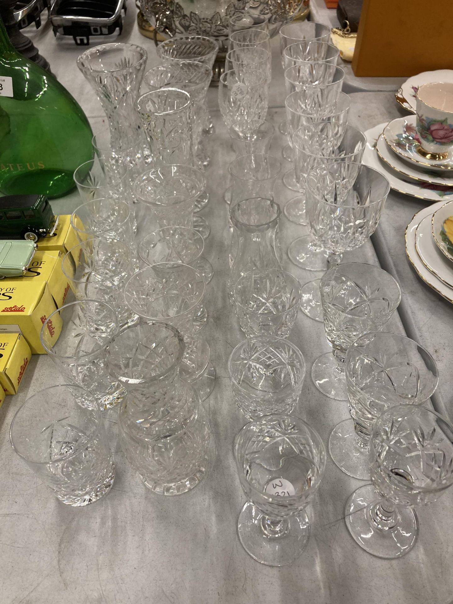 A LARGE COLLECTION OF CUT GLASS DRINKING GLASSES