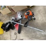 A PARKER BRAND PGMT-5200 PETROL MULTI TOOL WITH CHAINSAW AND STRIMMER ATTATCHMENT