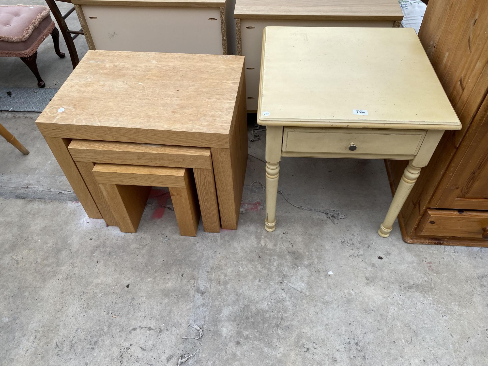 A PAINTED LAMP TABLE AND NEST OF THREE OAK TABLES