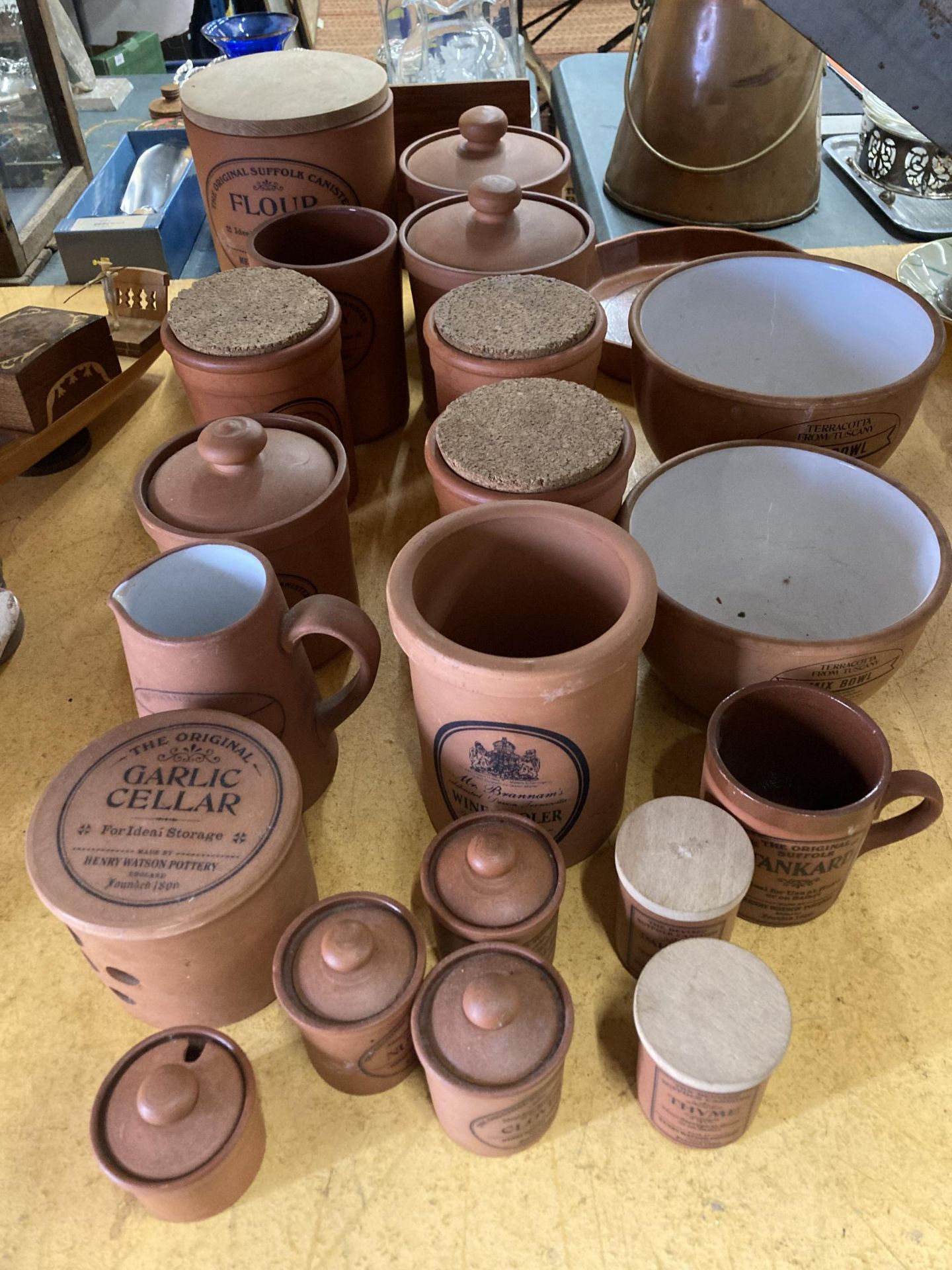 A LARGE COLLECTION OF TERRACOTTA STORAGE JARS AND BOWLS, THE MAJORITY BY HENRY WATSON POTTERY