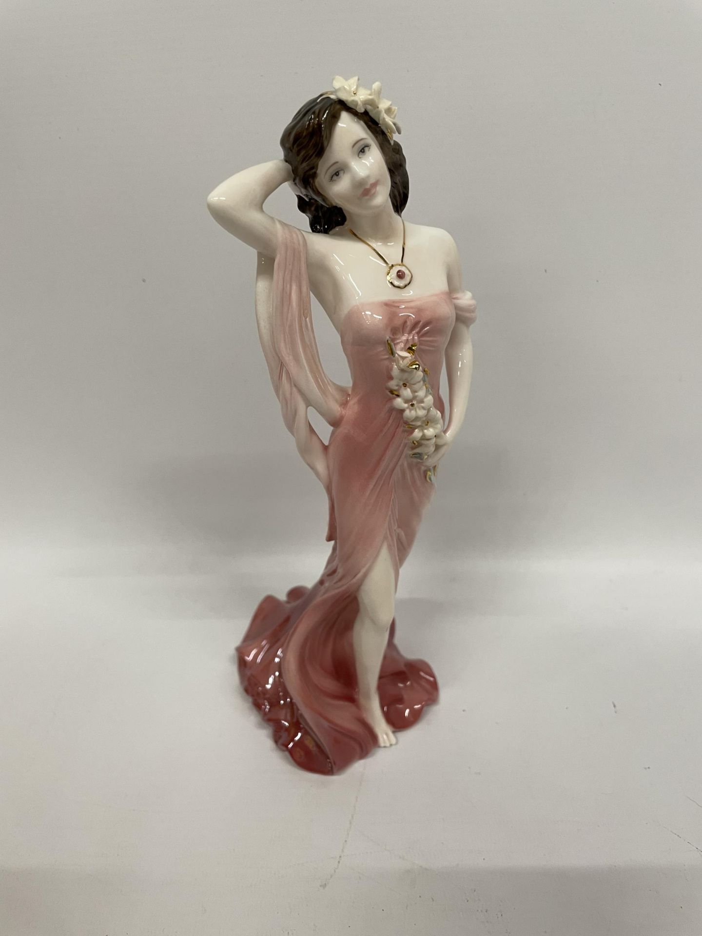 A COALPORT LIMITED EDITION 'RUBY' LADY FIGURE