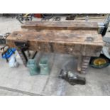 A VINTAGE WOODEN WORK BENCH WITH RECORD NO.52 WOOD VICE