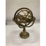 A BRASS DESK REVOLVING GLOBE STYLE COMPASS WITH BIRTH SIGNS