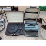 AN OLIVETTI TYPE WRITER AND A BUSH PORTABLE RECORD PLAYER