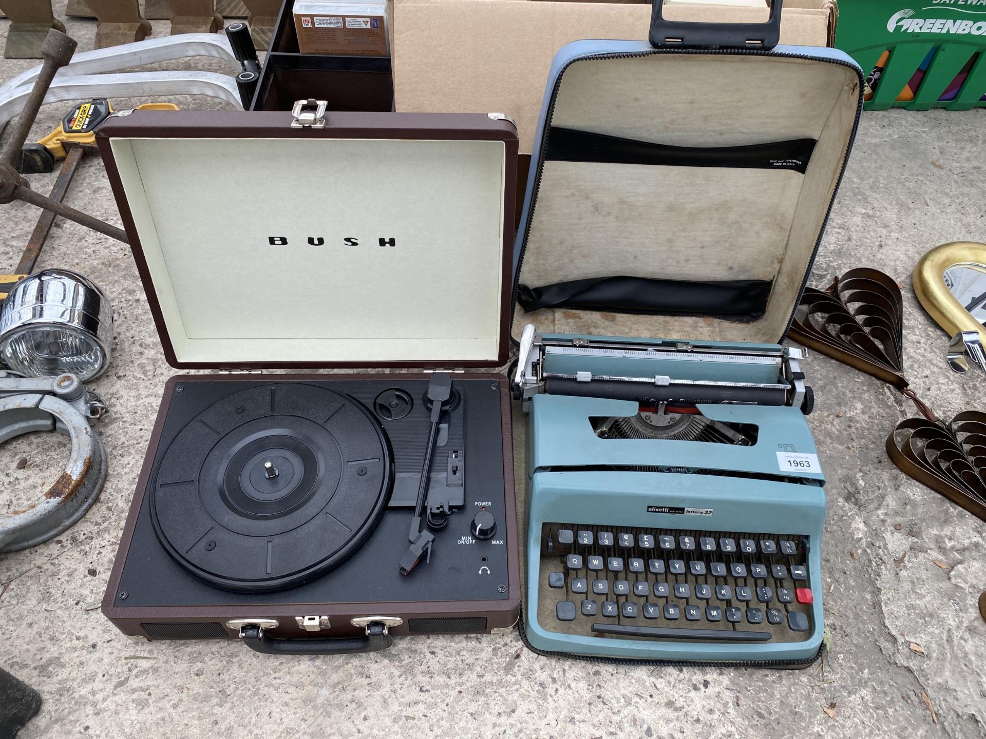 AN OLIVETTI TYPE WRITER AND A BUSH PORTABLE RECORD PLAYER