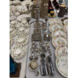 A QUANTITY OF SILVER PLATED ITEMS TO INCLUDE CANDLEABRAS, TABLE LIGHTERS, NAPKIN RINGS, TRINKET