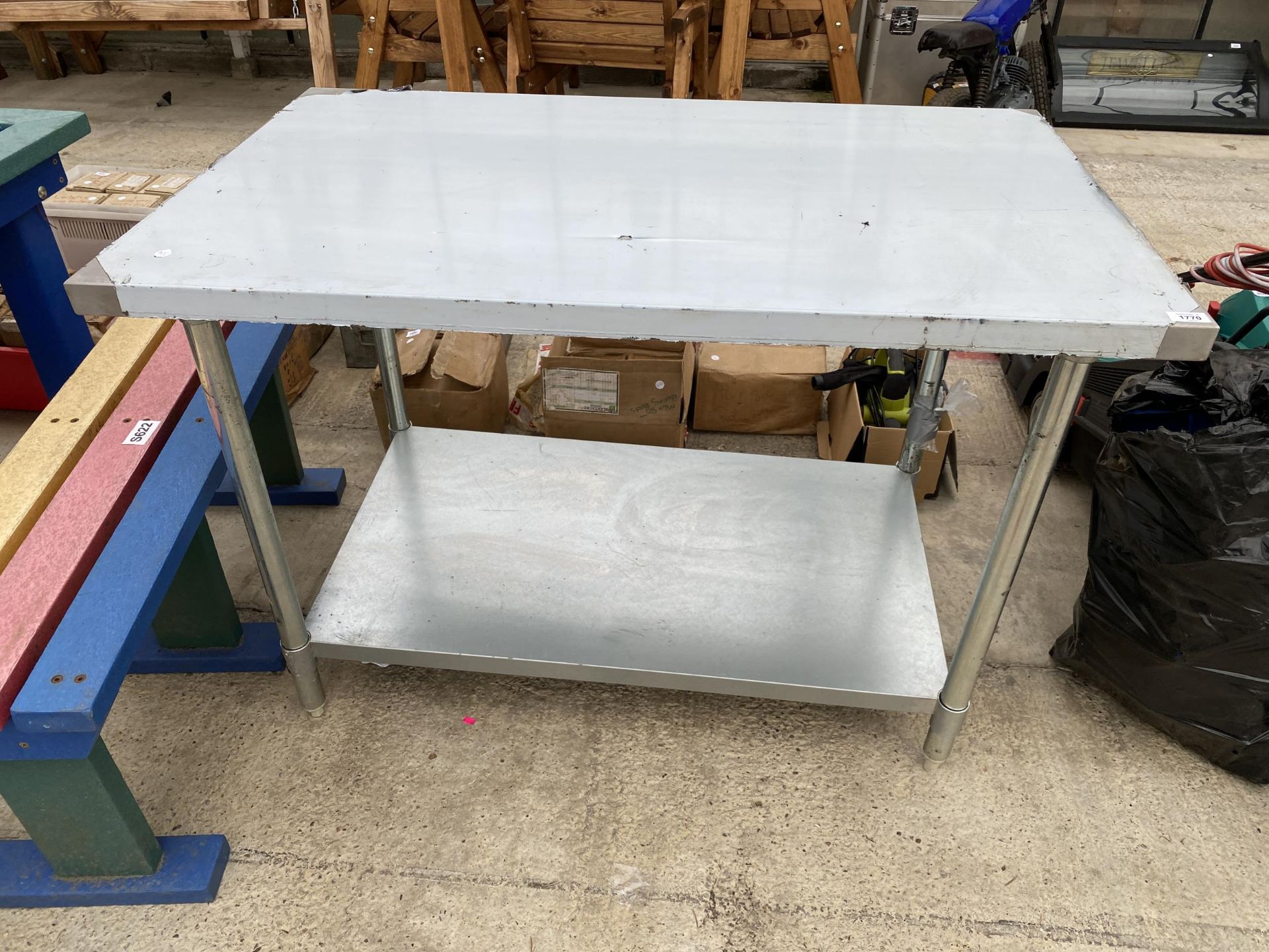A TWO TIER STAINLESS STEEL KITCHEN WORK UNIT