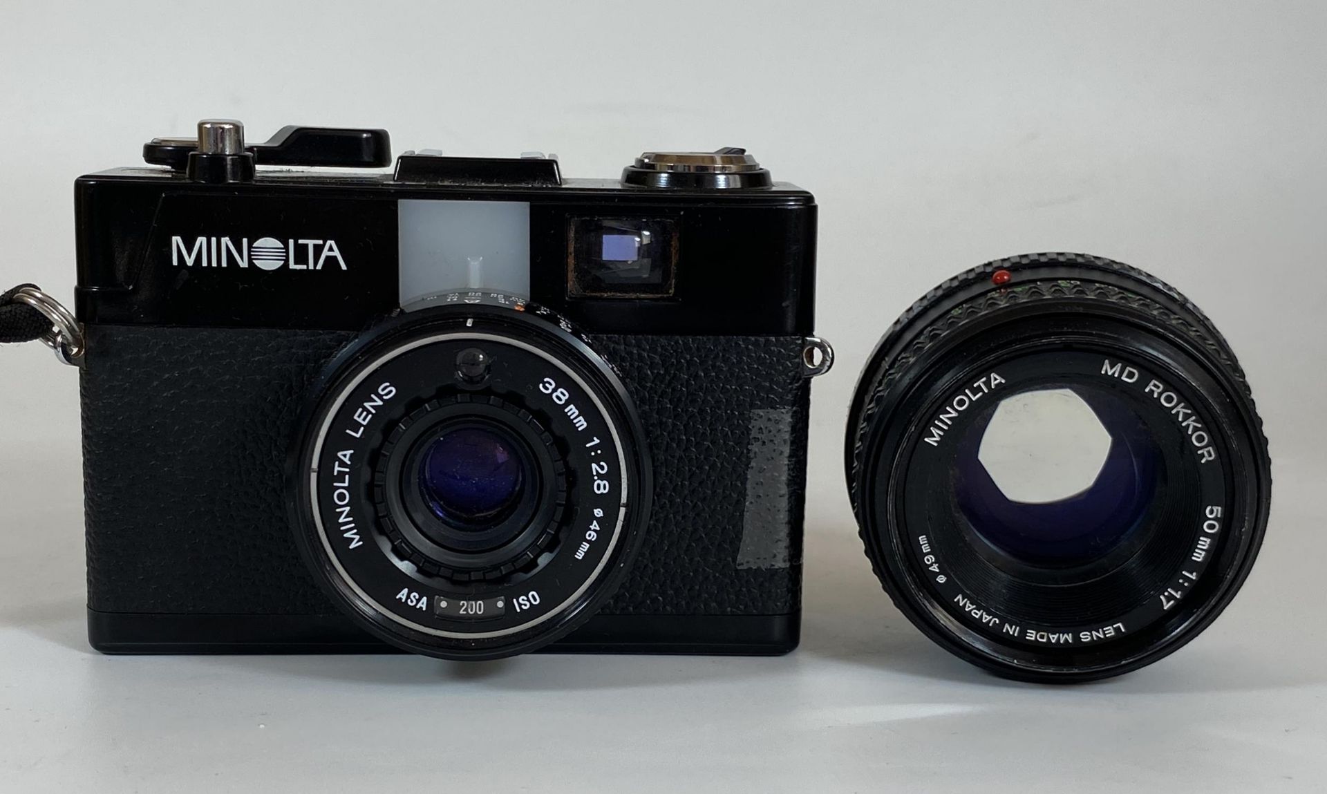 A MINOLTA CAMERA WITH 38MM 1:2.8 46MM LENS AND FURTHER MINOLTA MD ROKKOR 50MM 1:1.7 LENS