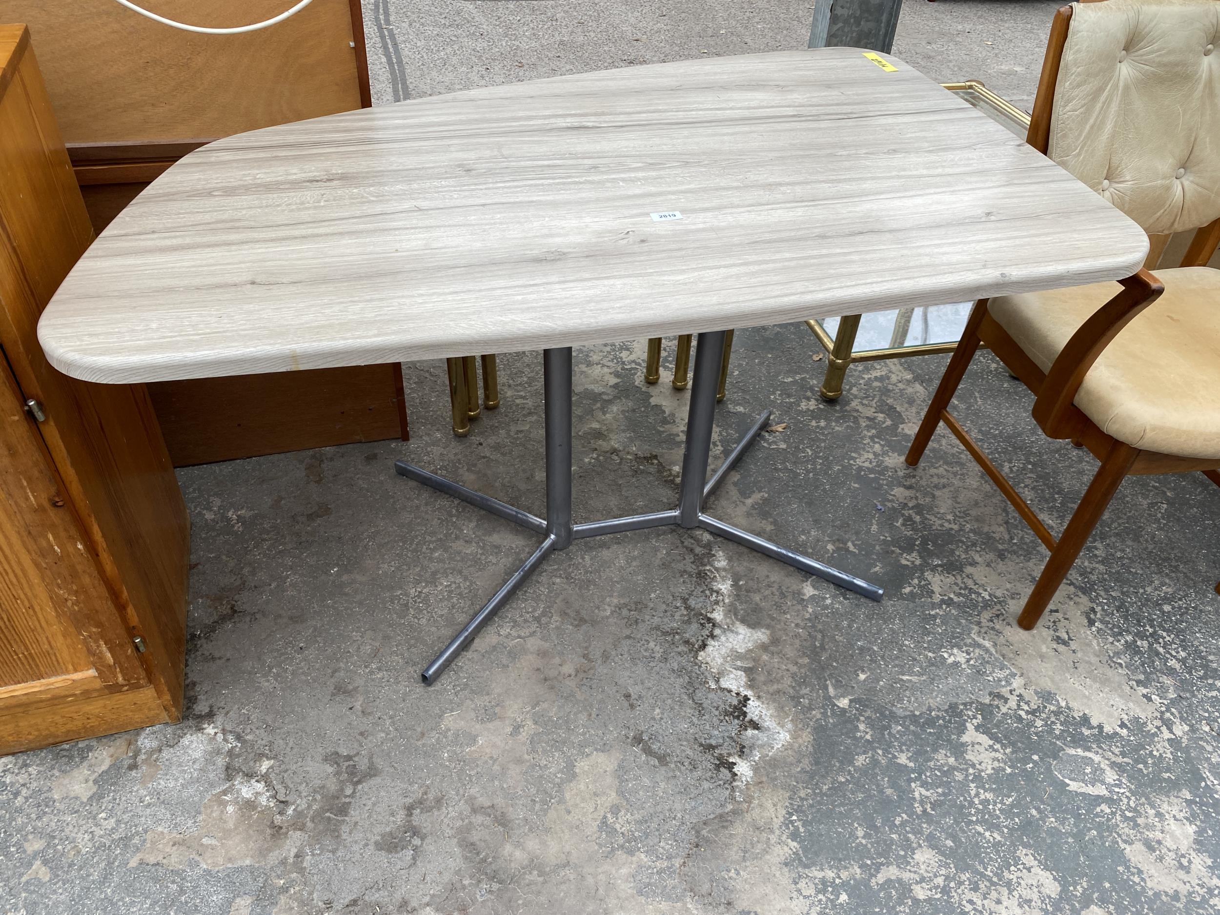 A MODERN OFFICE TABLE WITH OFFSET TOP, ON METALWARE BASE, 50 X 33" MAX