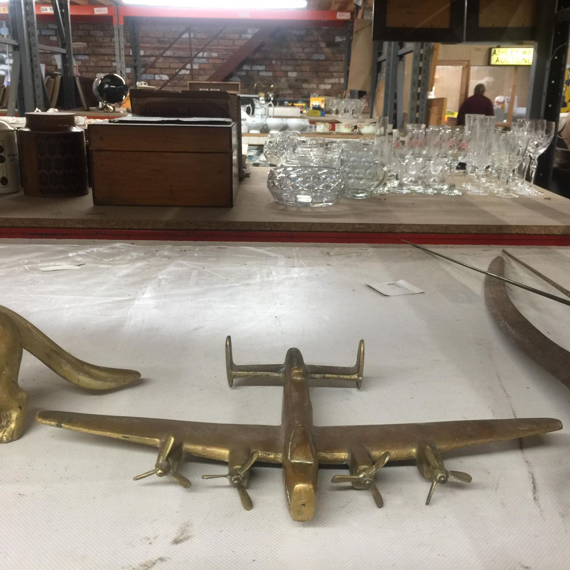 A HEAVY, SOLID BRASS AVRO LANCASTER BOMBER, LENGTH 25 CM