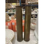 A PAIR OF TALL TRENCH ART SHELL VASES, DATED 1951