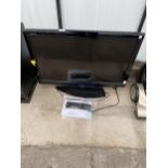 A SHARP 32" TELEVISION WITH REMOTE CONTROL