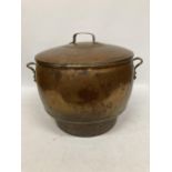 A LARGE VINTAGE TWIN HANDLED COPPER LIDDED TUREEN / BOWL