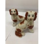 A PAIR OF STAFFORDSHIRE SPANIELS