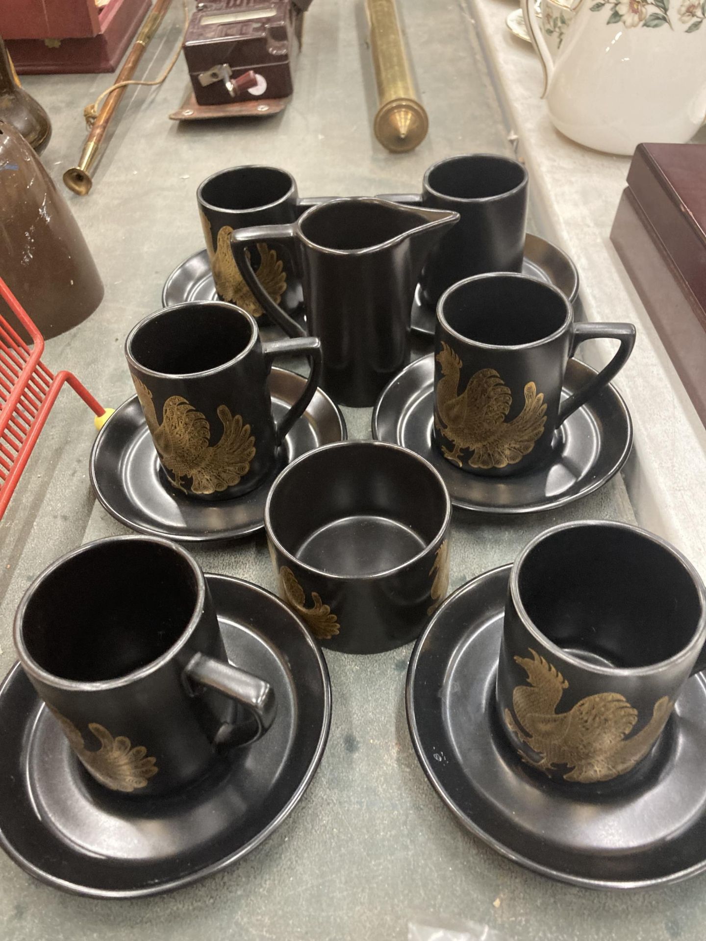 A PORTMEIRION BLACK AND GOLD PART COFFEE SET