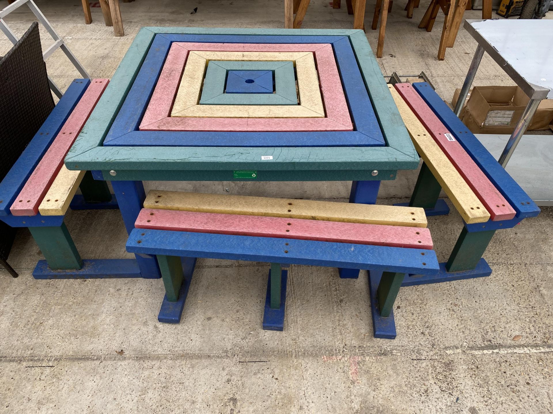 A HEAVY DUTY PLASTIC PICNIC TABLE AND THREE BENCHES