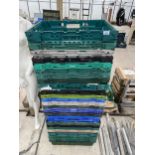 A LARGE QUANTITY OF PLASTIC STACKING CRATES