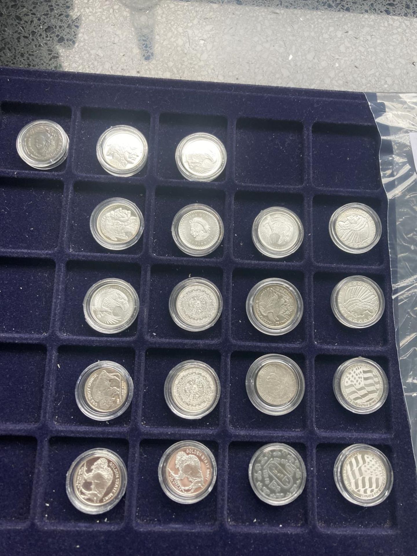 A TRAY CONTAINING EIGHTEEN 1/10 OUNCE PURE SILVER COINS