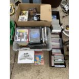 A LARGE ASSORTMENT OF CDS AND DVDS