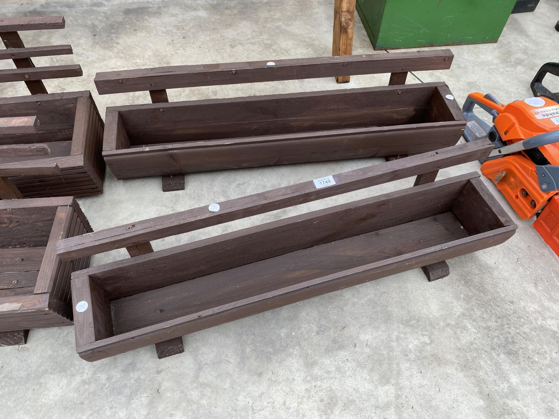 TWO WOODEN TROUGH PLANTERS WITH TRELIS BACKS