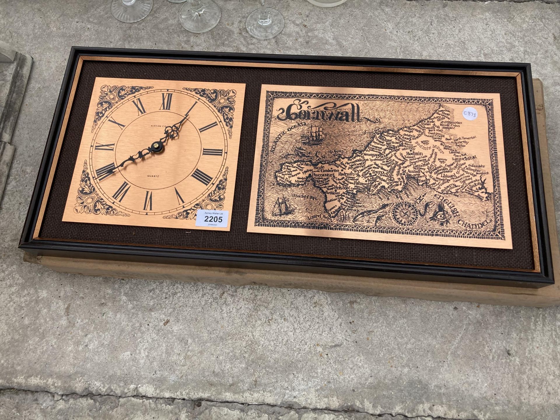 A FRAMED ETTCHED MAP OF CORNWALL AND A CLOCK