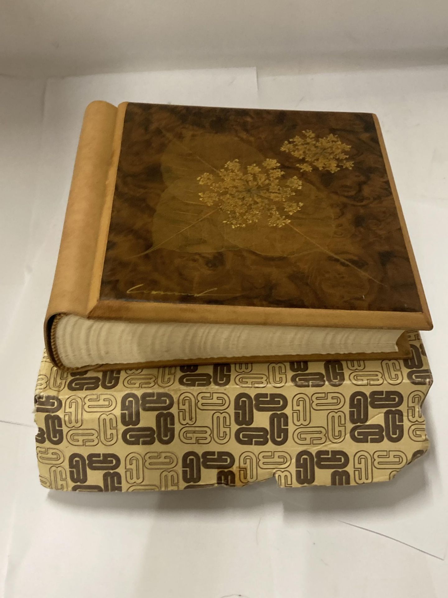 A WOOD AND LEATHER POST CARD ALBUM, BOXED