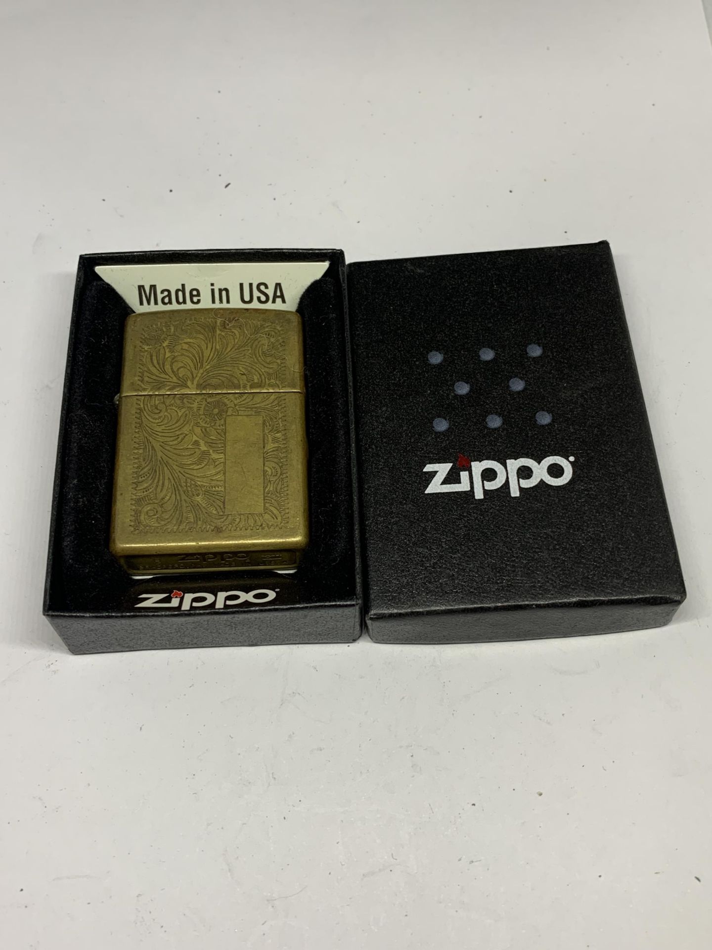 A BRASS ZIPPO LIGHTER IN ORIGINAL PRESENTATION BOX