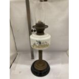 A VINTAGE OIL LAMP WITH BRASS CORINTHIAN COLUMN SUPPORT AND PAINTED WINDMILL SCENE RESEVOIR